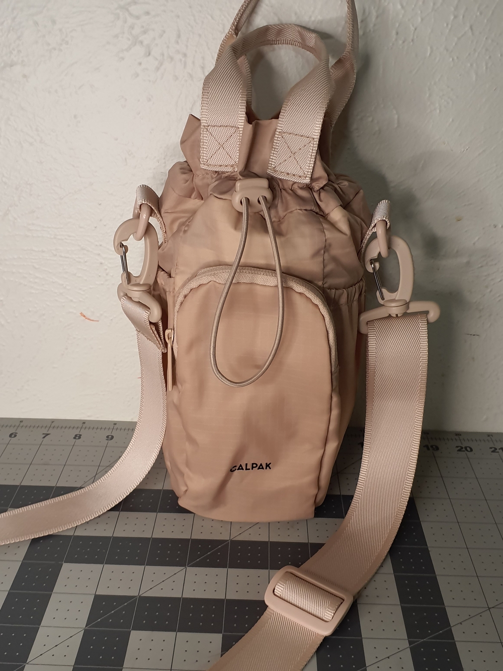 Calpak Blush Beige Drawstring Crossbody Bottle Tote